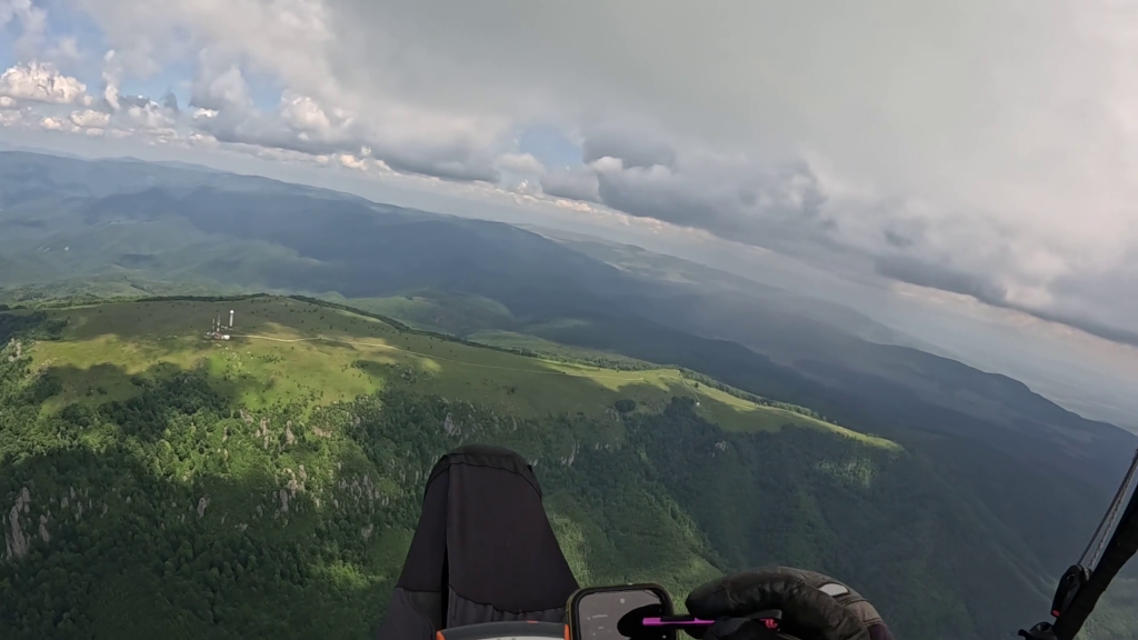 First person view of using a stylus on a smartphone mid-flight
